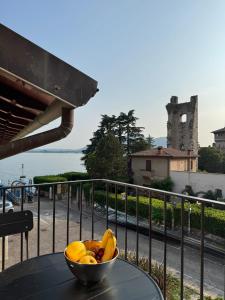 a bowl of bananas sitting on a table on a balcony at La Maison du Lac Iseo 3 in Predore