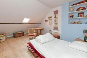 En eller flere senge i et værelse på Maison Ty Gwen