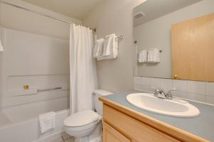 a bathroom with a white toilet and a sink at Tyra Stream 234 by Ski Country Resorts in Breckenridge +16 photos