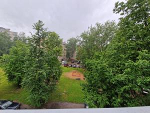 an overhead view of a park with trees and cars at Vienības 34 in Daugavpils
