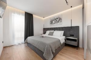 Postel nebo postele na pokoji v ubytování Luxury Apartment Luka