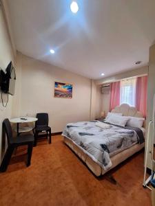 Postel nebo postele na pokoji v ubytování Studio1 Apartment Transient House near SPMC Robinsons and SM Lanang