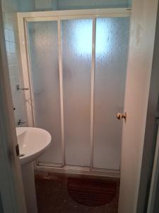 a bathroom with a shower and a sink at Nueva 6 in Algeciras +4 photos