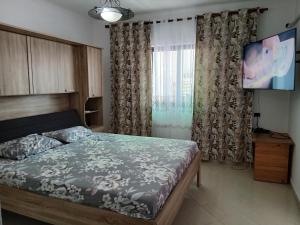 Ένα ή περισσότερα κρεβάτια σε δωμάτιο στο Apartment Tirana