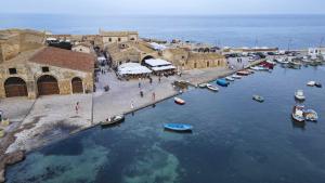 an aerial view of a harbor with boats in the water at Acquamarina in Pachino