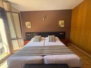 Postel nebo postele na pokoji v ubytování Hotel Guara Inlukā