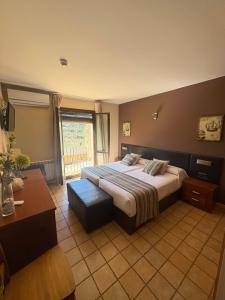 Postel nebo postele na pokoji v ubytování Hotel Guara Inlukā