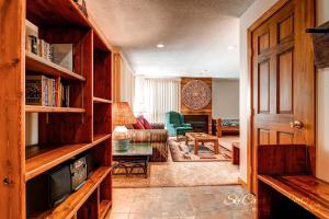 a living room with a couch and a table at Ski Hill 15 by Ski Country Resorts in Breckenridge