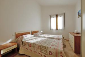 Una cama o camas en una habitación de Il giardino di Elisa