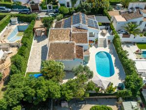 an aerial view of a house with a swimming pool at Ca Rulleta Jávea in Jávea