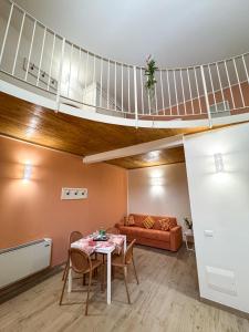 a living room with a table and a loft at BONA NOVA-Puglia Living in Massafra