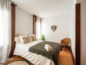 Ένα ή περισσότερα κρεβάτια σε δωμάτιο στο Akisol Troia Retreat