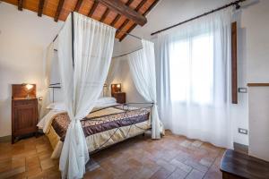 Ένα ή περισσότερα κρεβάτια σε δωμάτιο στο Agriturismo Poggiacolle