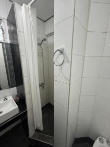 a bathroom with a shower and a sink at Departamento Mis Nonos 4 in Mendoza +8 photos