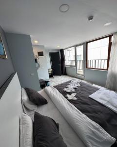 Postel nebo postele na pokoji v ubytování Taksim Escape Suites HOTEL