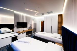Postel nebo postele na pokoji v ubytování Hotel Bavaria + 37 fotografií