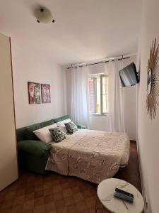 En eller flere senge i et værelse på Rosanna House