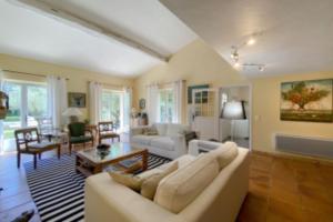 a living room with a couch and a table at Villa with 5 Bedrooms and Private Pool in Grimaud