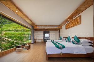 Longsheng Xichuangyue B&B Hotel客房内的一张或多张床位