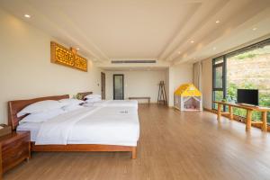 Longsheng Xichuangyue B&B Hotel客房内的一张或多张床位