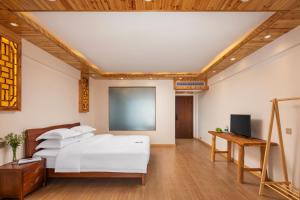 Longsheng Xichuangyue B&B Hotel客房内的一张或多张床位