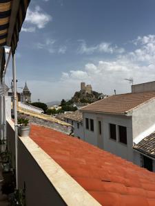 a view from the roof of a building with a castle in the background at La terraza de la subbética in Luque