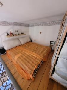 Una cama o camas en una habitación de Casa Nettuno