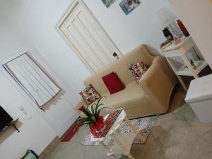 a living room with a couch and a table at La casa di Dea in Marsala