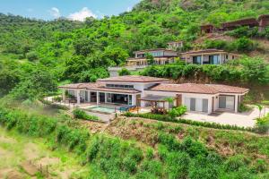 an aerial view of a house on a hill at Ocean View Villa & Private Pool in Mar Vista in Brasilito