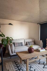 a living room with a couch and a coffee table at Coelho 145 in Porto