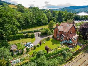 an aerial view of a large house with a yard at Outstanding Llangollen Riverside Apartment in Llangollen +21 photos