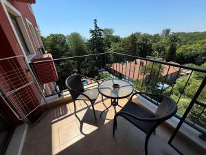 a balcony with a table and chairs on a balcony at Villa Mare Apartment in St. St. Constantine and Helena