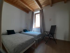 Postel nebo postele na pokoji v ubytování Alloggio Vinadio