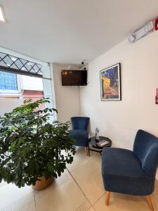 TV a/nebo společenská místnost v ubytování HOTEL COMFORT- Inn