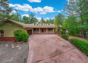 a house with a driveway in front of it at Spacious 3BR Yavapai Retreat with Nature Views, Hot Tub and Game Room in Sedona