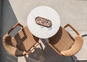 a table and chairs with a table and a table at Olenia Suites in Neos Marmaras