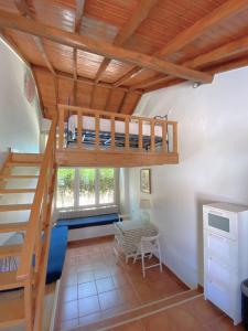 a room with a loft bed and a desk at Quinta Maria Gil - B in Lourinhã