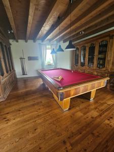 a pool table in the middle of a room at B&B Il Posto delle Rose in Almenno San Salvatore