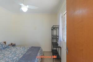 a bedroom with a bed and a staircase in a room at Chácara em São Pedro com piscina e churrasqueira in São Pedro