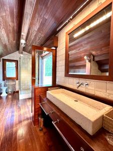 a bathroom with a large sink and a mirror at Torre de las Águilas, Bellver, Puigcerdá in Bellver de Cerdanya +66 photos