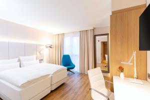 Voodi või voodid majutusasutuse NH Mannheim toas