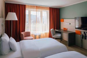 Letto o letti in una camera di Pentahotel Leipzig