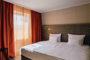 Letto o letti in una camera di Pentahotel Leipzig