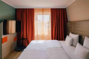 Letto o letti in una camera di Pentahotel Leipzig