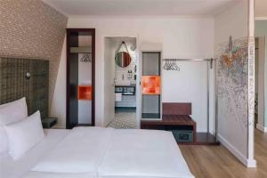 Letto o letti in una camera di Pentahotel Leipzig