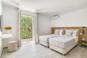 Ένα ή περισσότερα κρεβάτια σε δωμάτιο στο Mikon Luxury Villa +22 φωτογραφίες
