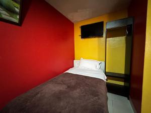 Una cama o camas en una habitación de Hotel Jimmy Latacunga