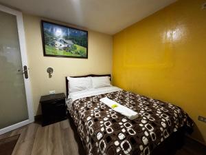 Una cama o camas en una habitación de Hotel Jimmy Latacunga