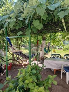 a playground with a table and a swing set at Rooms-Zejnep SARAJEVO in Sarajevo