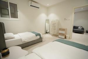 Ένα ή περισσότερα κρεβάτια σε δωμάτιο στο Apartment with Private Entrance - 1A